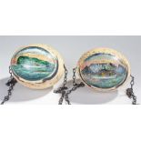 Pair of South African painted ostrich eggs, painted with a ship at sea off the coast of Cape Town,