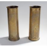 Two First World war trench art shells, engraved with a soldiers and Scots playing bagpipes, dated to