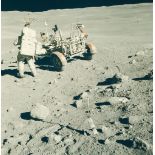 Charles Duke and the lunar rover at the base of Stone Mountain at Station 6 Charles Duke and the