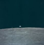 Charles Duke - The Command Module and the Earth both rising over the lunar horizon, Apollo 16, April