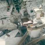 Charles Duke - John Young changing a film magazine in the Hasselblad camera, Apollo 16, EVA 2, April