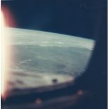 The Earth illuminated by the Sun during the first orbit, Gemini 3, March 1965 Vintage chromogenic