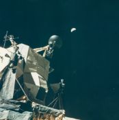 Eugene Cernan - A half Earth hangs over the LM “Challenger” on the lunar surface, EVA 3, Apollo