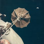 Harrison Schmitt - Eugene Cernan and the Earth above the antenna on the rover, EVA 3, Apollo 17,