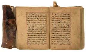 Arabic manuscript in black birahi script, surat headings and some diacritics...  Arabic manuscript