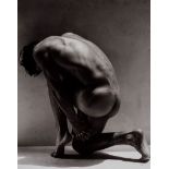 Greg Gorman (b.1949) - Tony Kneeling, 1988 Gelatin silver print, flush mounted to card, signed,