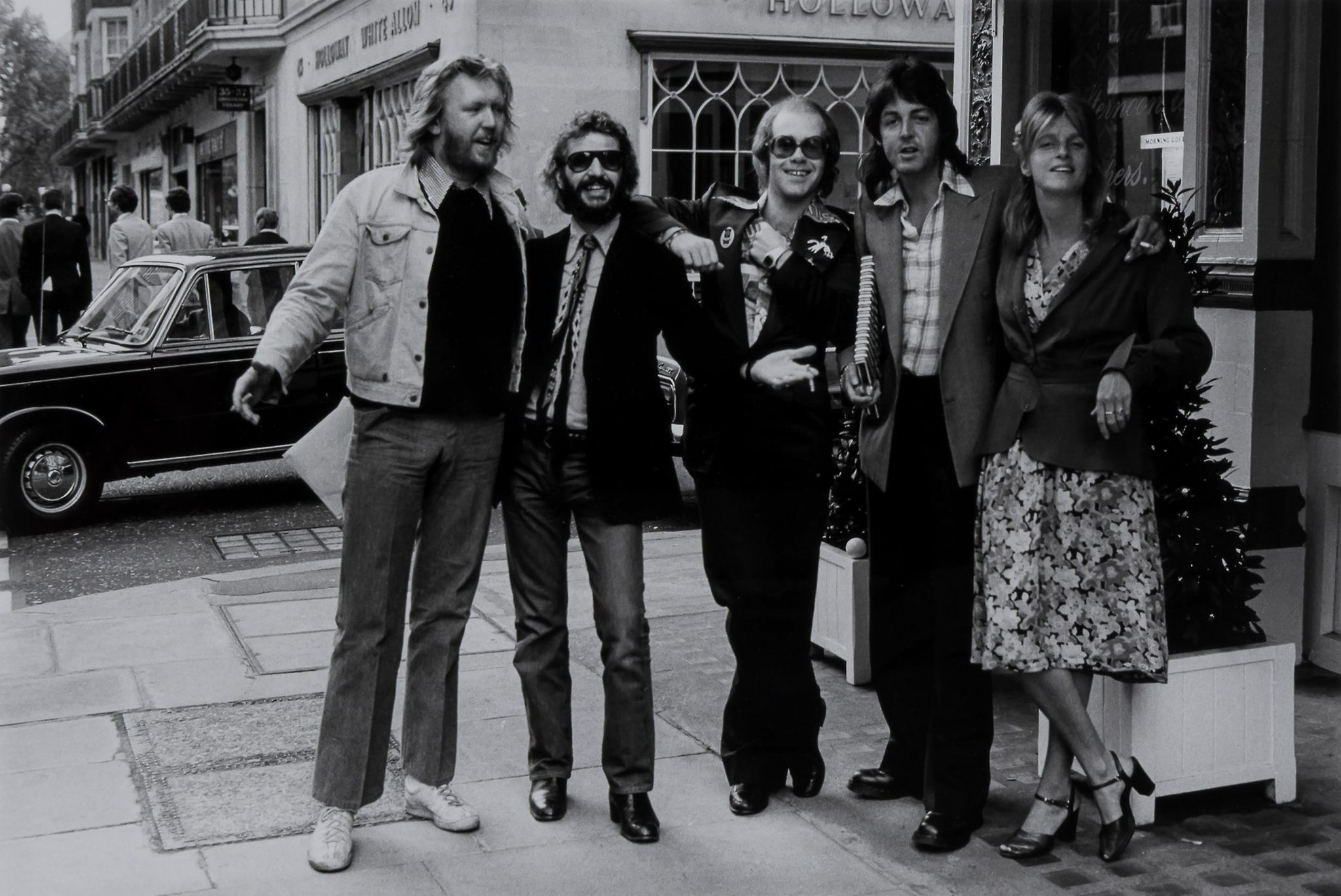 Terry O'Neill (b.1938) - Elton John Seeing Old Friends, London, 1976 Gelatin silver print, printed