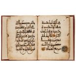 Large section from a Maghribi Qur'an.- - 92ff Arabic manuscript in dark brown ink on paper,