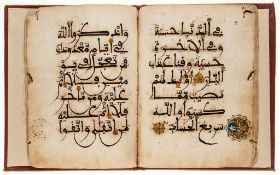 Large section from a Maghribi Qur'an.- - 92ff Arabic manuscript in dark brown ink on paper,