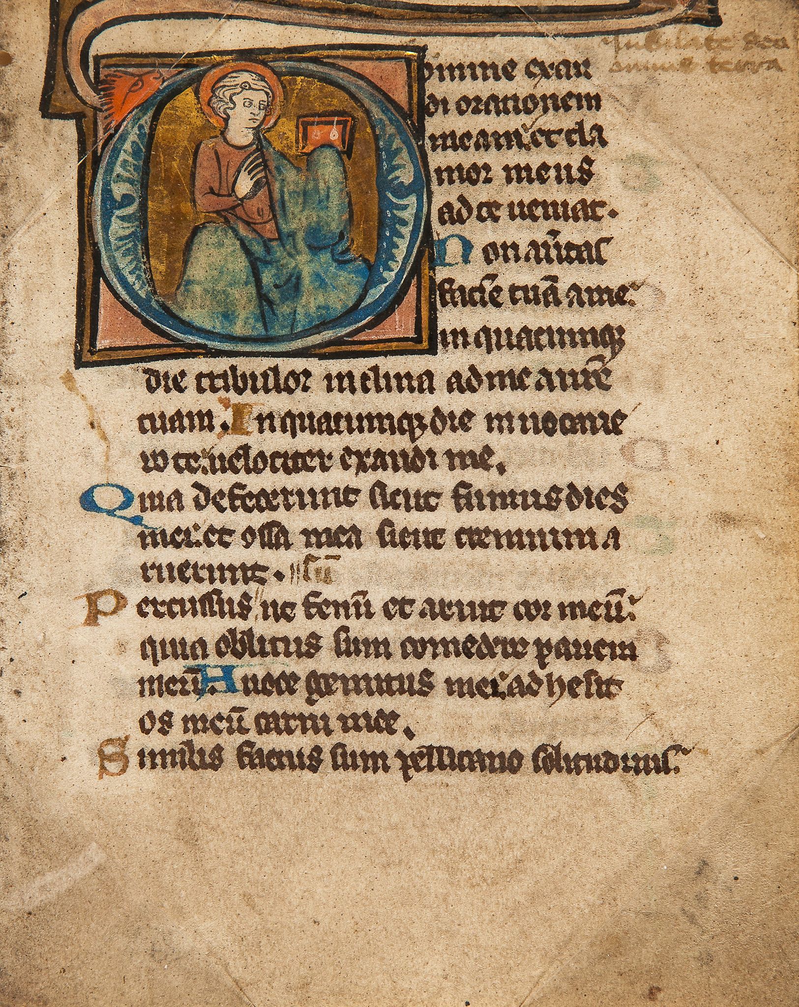 Young saint holding a book, - in an initial on a leaf from an illuminated Psalter  in an initial - Image 2 of 2