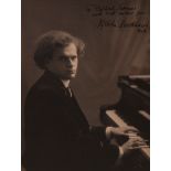 BACKHAUS, WILHELM - Vintage, sepia toned photograph of Wilhelm Backhaus seated at the... Vintage,
