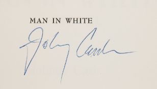 CASH, JOHNNY & JUNE CARTER CASH - Man in White, signed by Johnny Cash on front free endpaper  Man in