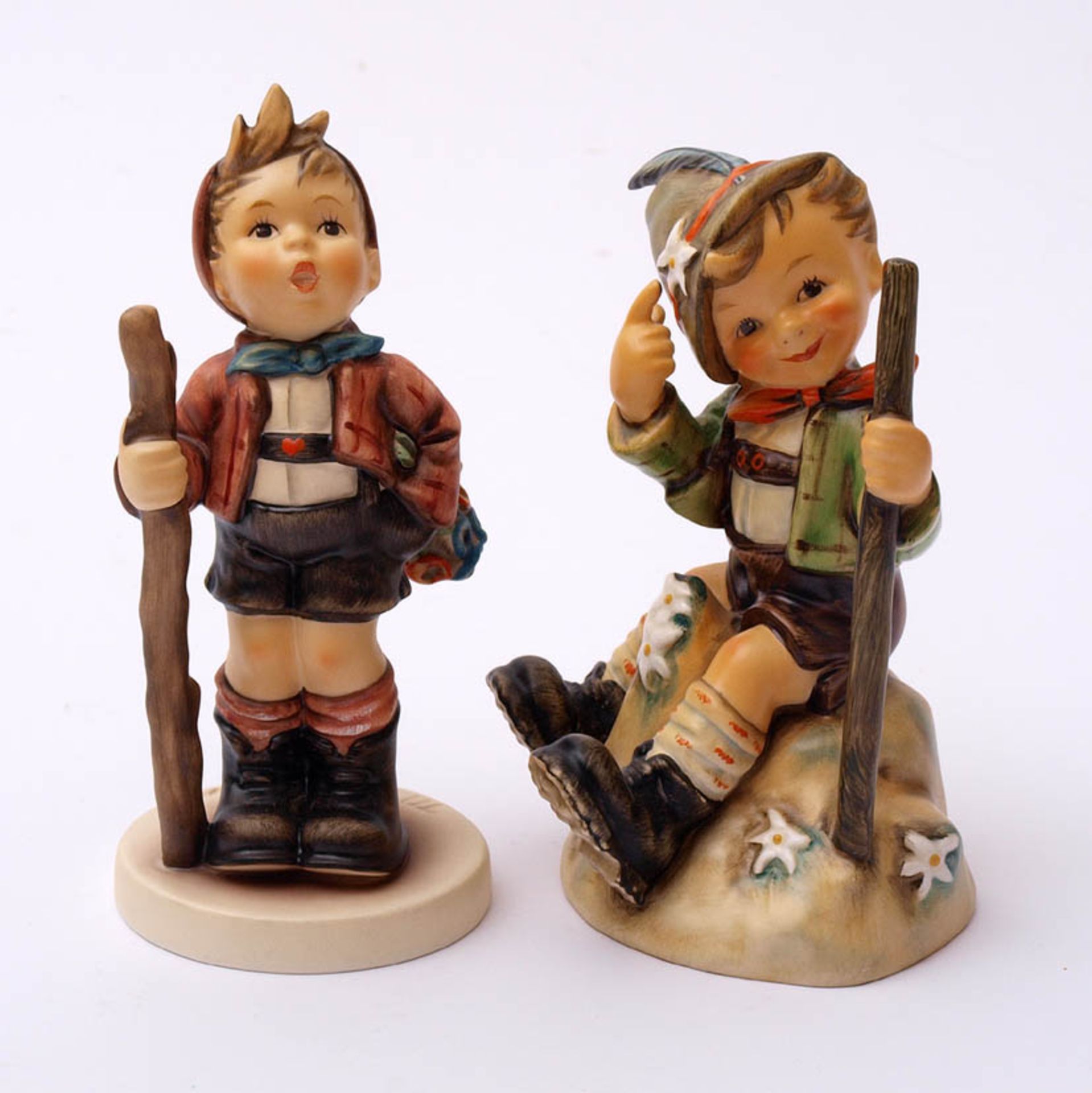 Zwei Hummelfiguren, Goebel"Wanderbub" aus "Swiss collection" (H.13cm) und "In die weite Welt" (H.