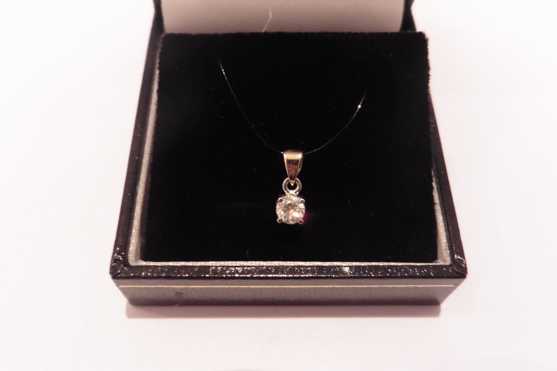 Pre-owned 18ct gold solitaire style pendant set with a small round cut diamond, of H/I colour weighi