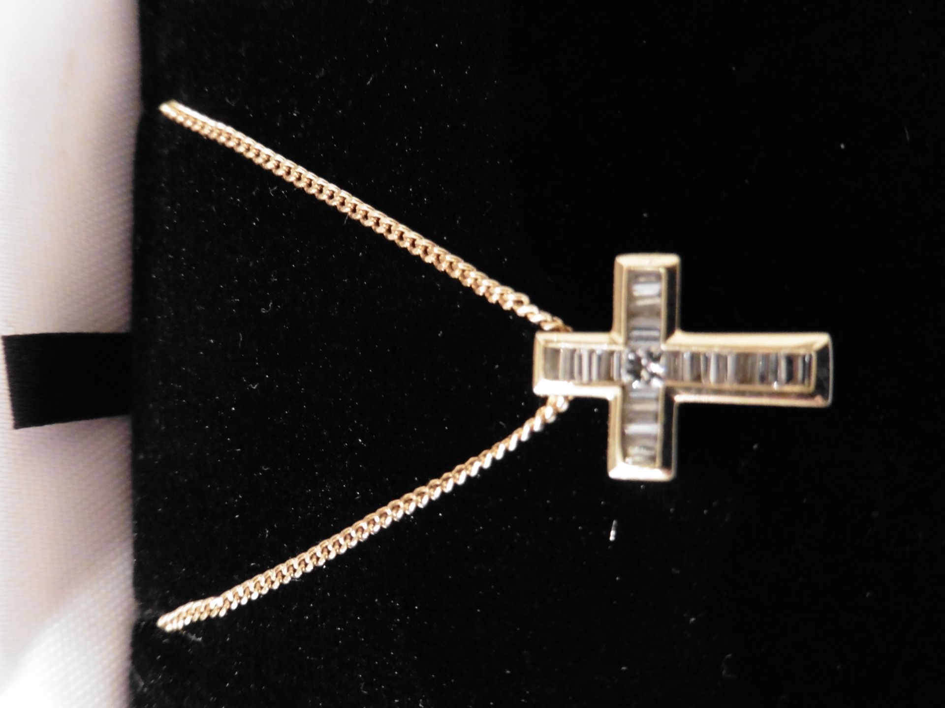 Pre-owned 18ct yellow gold diamond cross pendant set with 1 small princess cut diamond in the centre