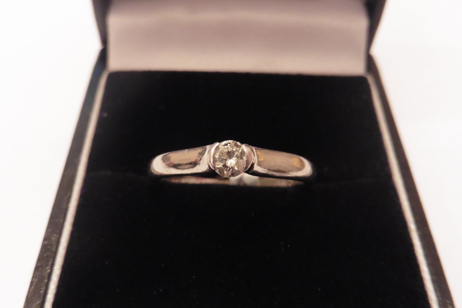 Pre-owned Palladium diamond solitaire ring set with a 0.33ct brilliant cut diamond of H/I colour.  T