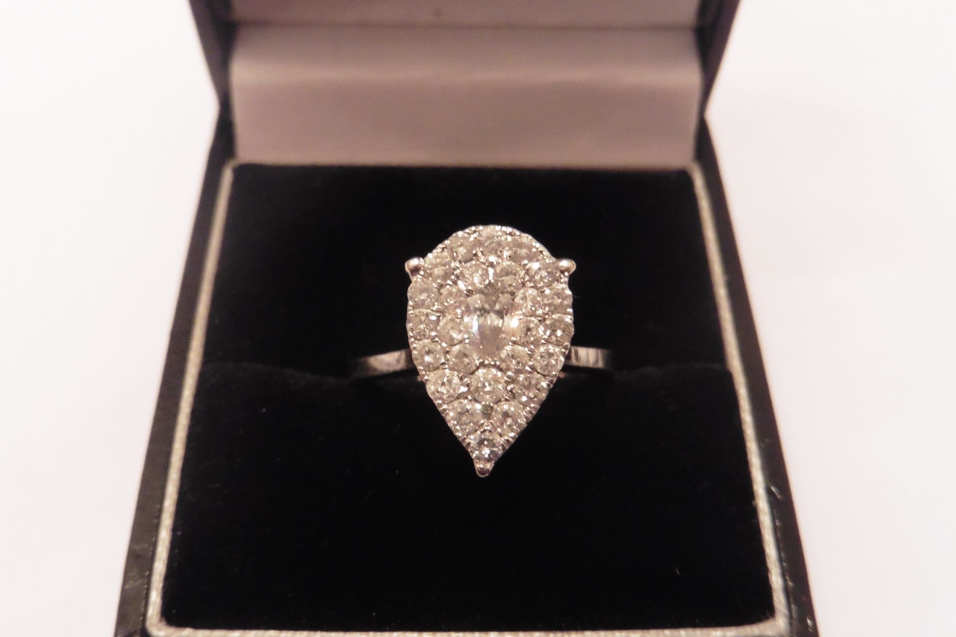 Pre-owned 18ct white gold diamond dress ring set with graduated round cut diamonds of beautiful colo