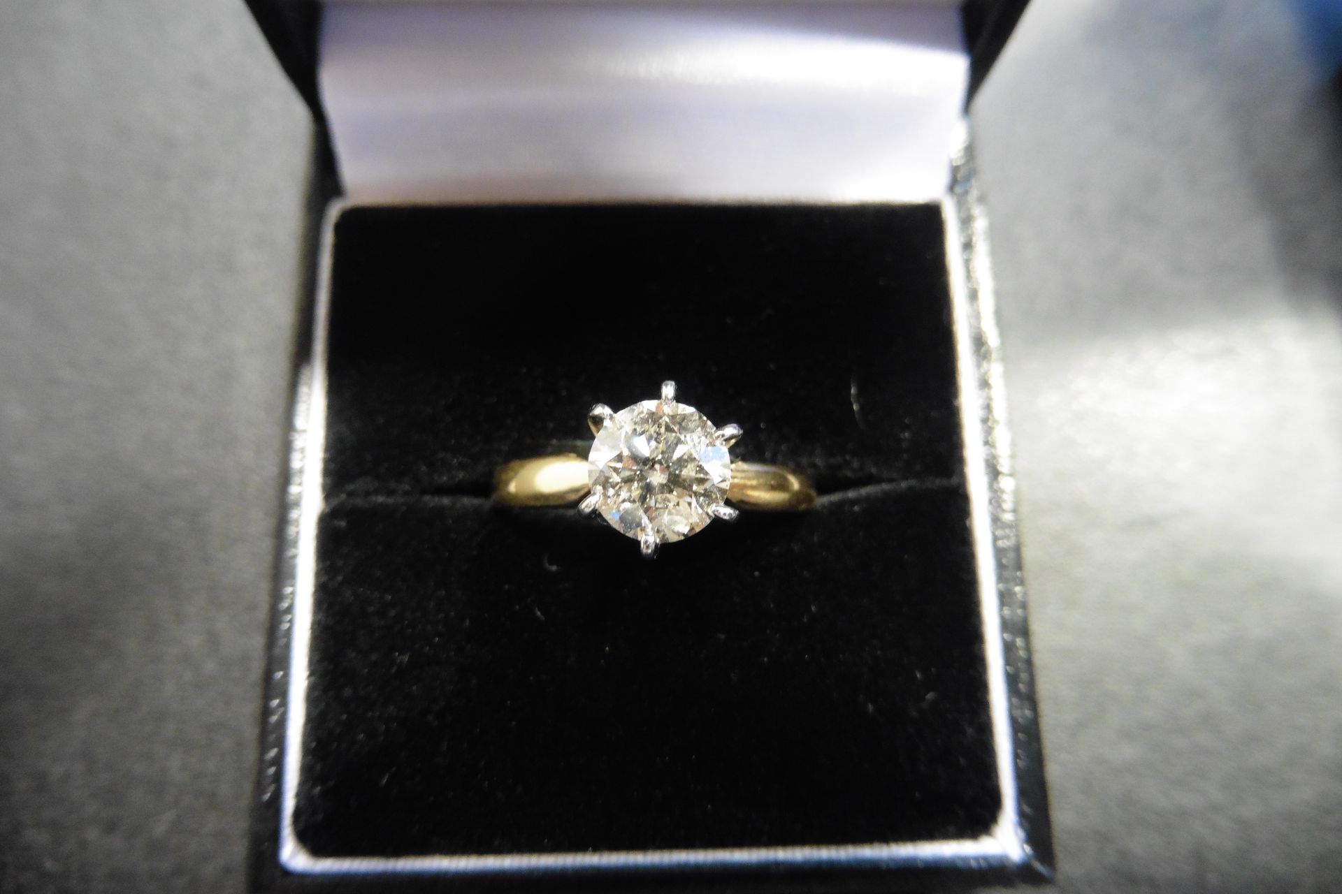 Diamond solitaire ring set with a top russian cut diamond weighing 1.25ct of J colour and SI clarity