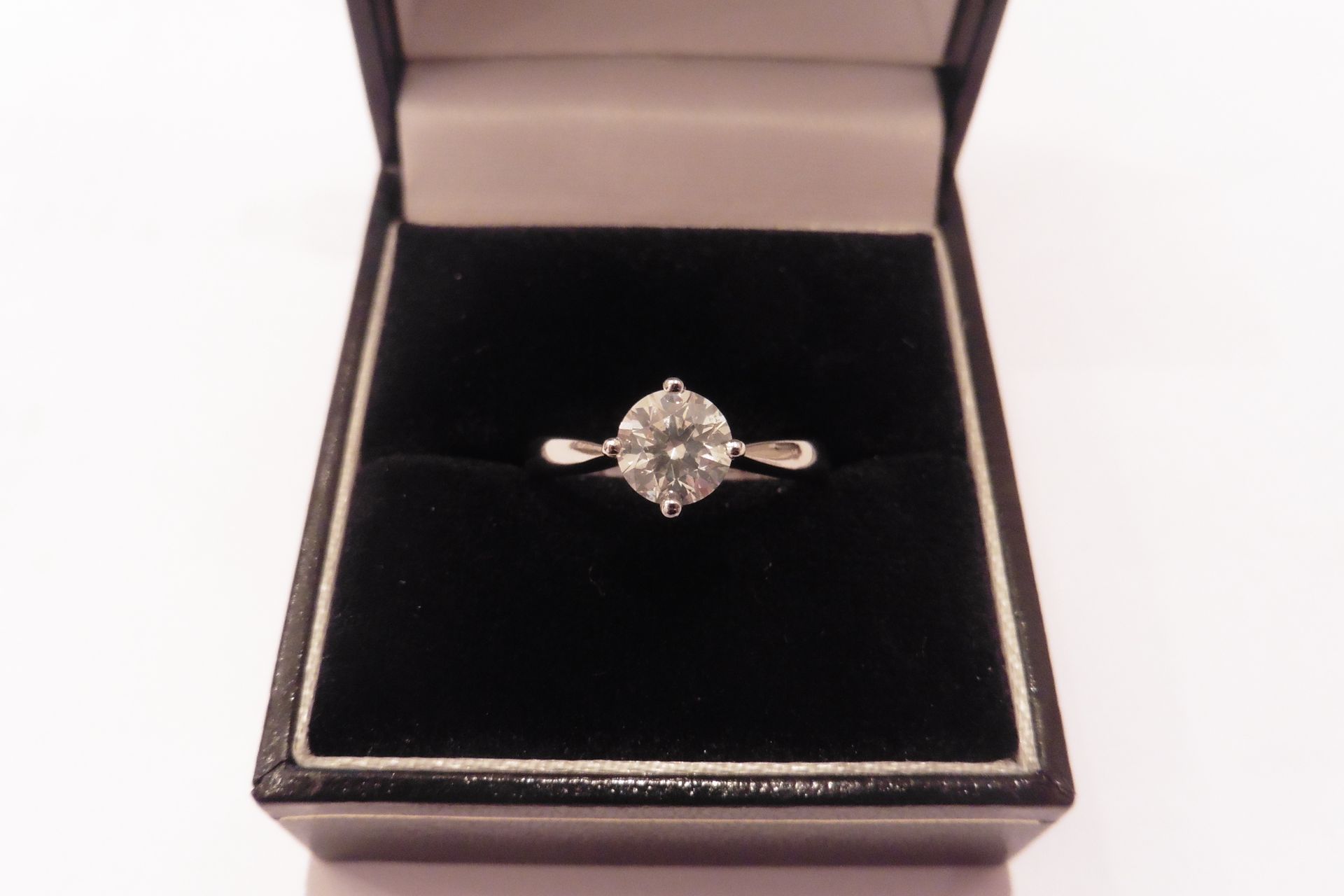 Simple Tiffany style diamond solitaire ring set with a 0.90ct russian cut diamond of H colour and SI