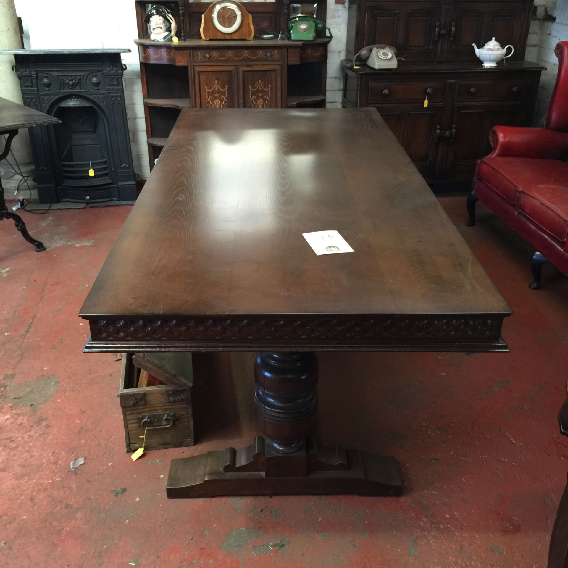 Extremely good condition.  Solid dark wood table from 1930's.  Refectory style base with a decorativ