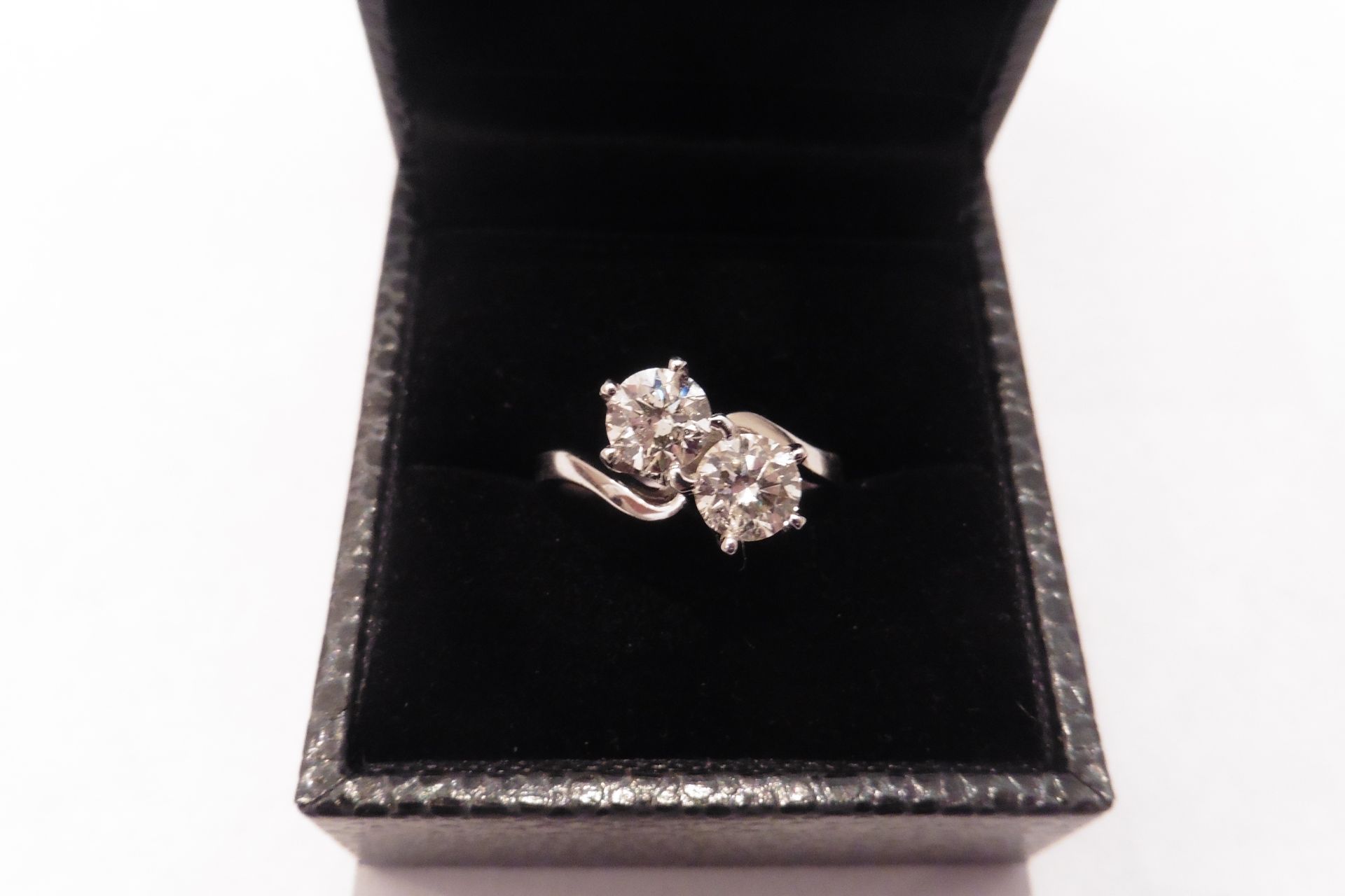 18ct white gold two stone twist diamond ring with two top cut diamonds of H colour and SI3 clarity,