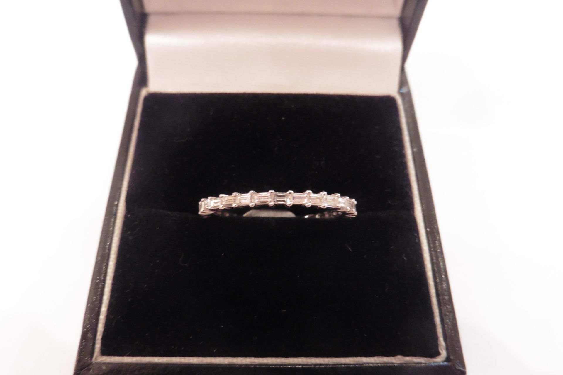 18ct white gold full diamond band ring set with small baguette cut diamonds, of H/I colour and Si cl