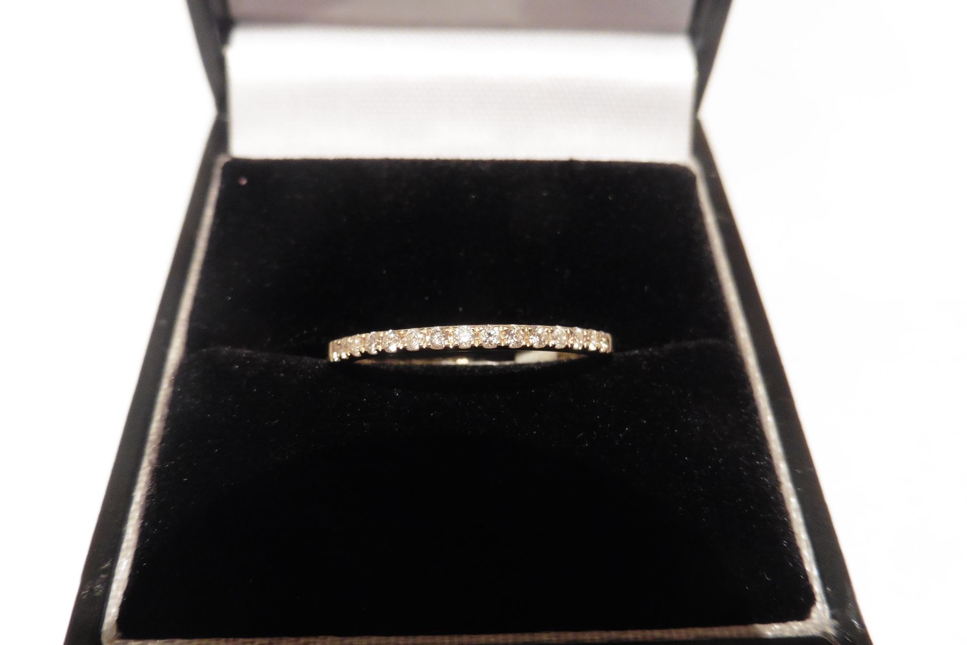 18ct yellow gold diamond eternity style ring.  Set with small round cut diamonds, of H colour and S