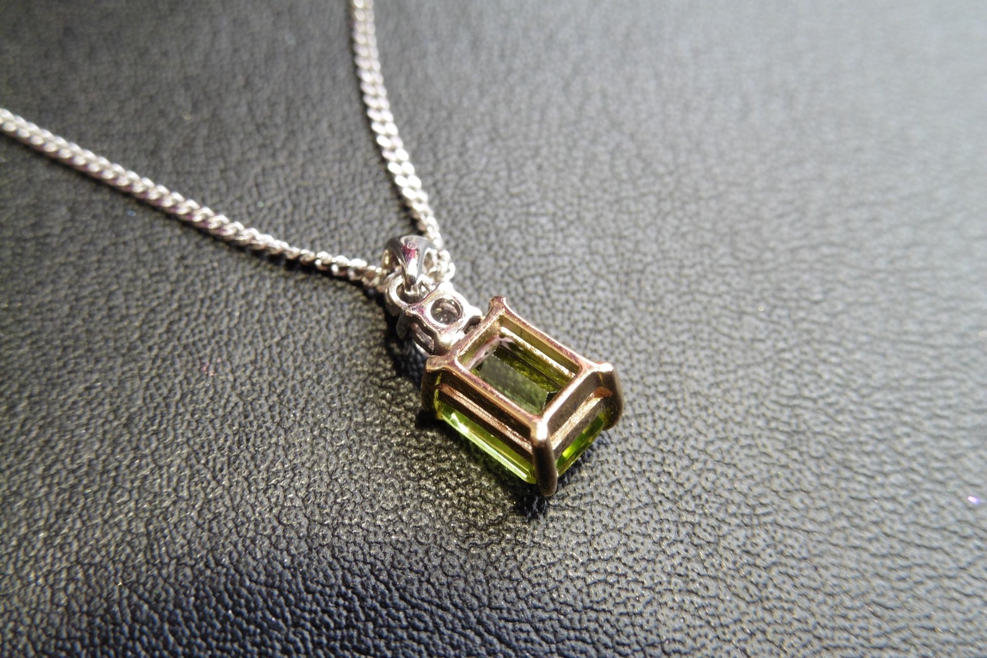 9ct white and yellow gold  peridot and diamond pendant set with an emerald cut peridot weighing 2.00 - Image 2 of 2