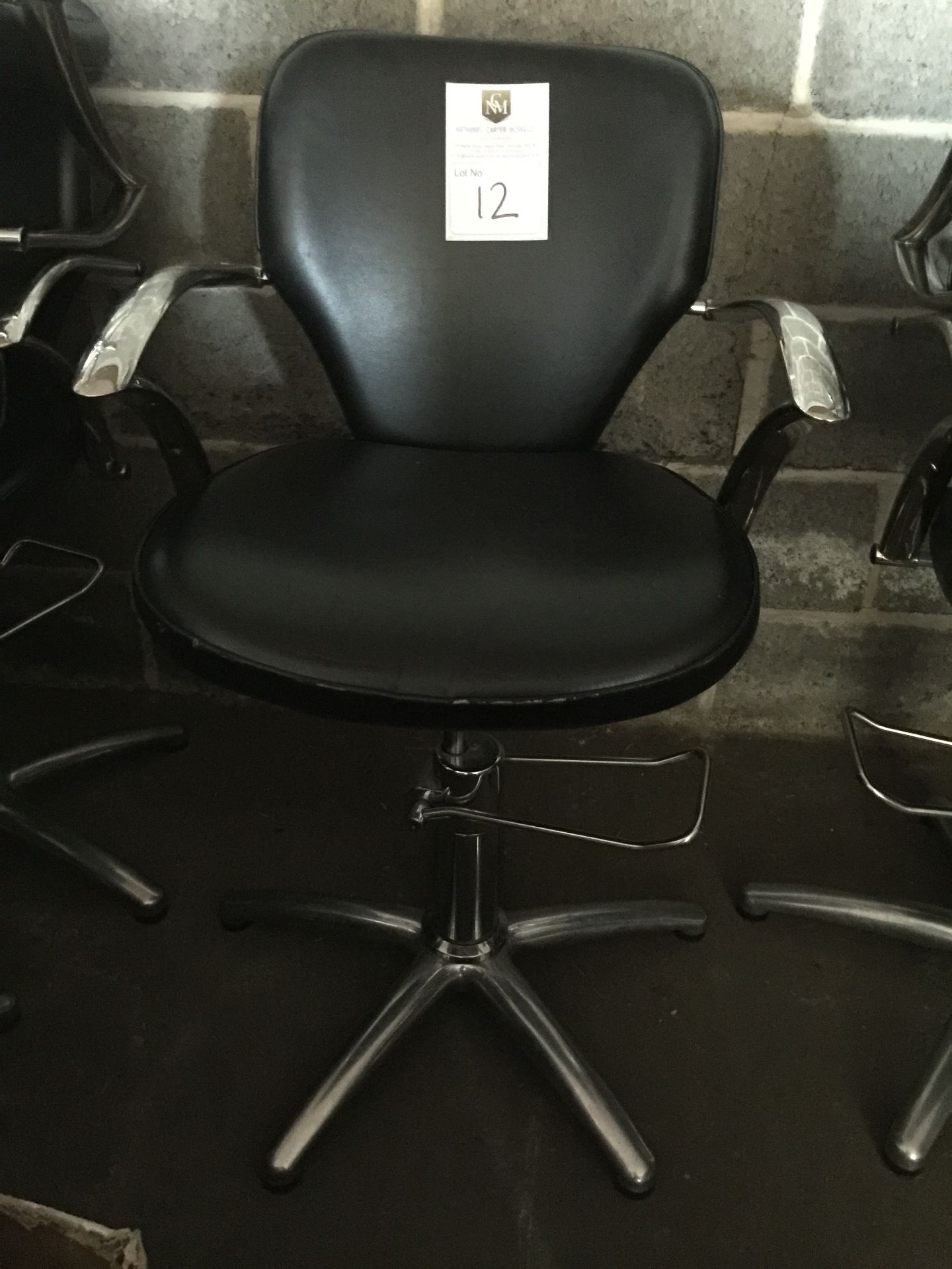Salon Chair - Adustable height.  Black and Chrome.  Good condition, but in need of a clean.  One arm