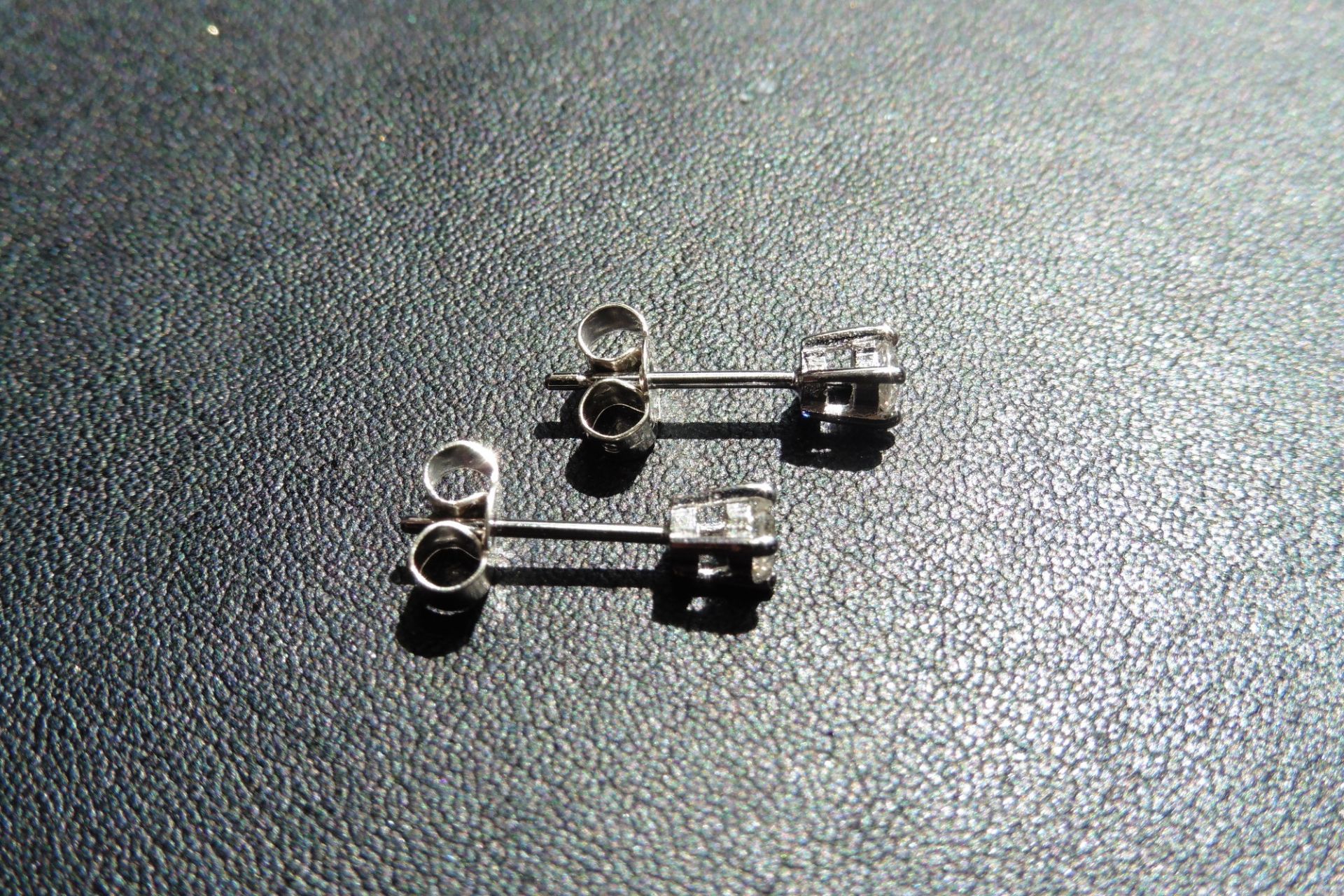 9ct white gold diamond solitaire style earrings each set with a small brilliant cut diamond weighing - Image 2 of 2