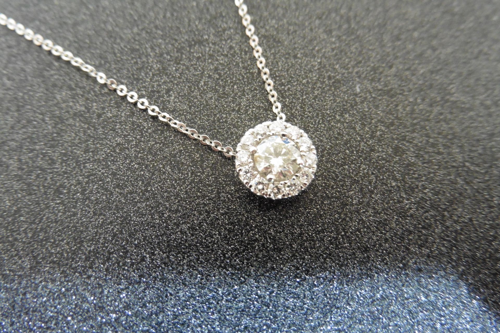 18ct white gold diamond pendant.  Set with a centred 0.30ct russian cut diamond, H colour and SI2 cl