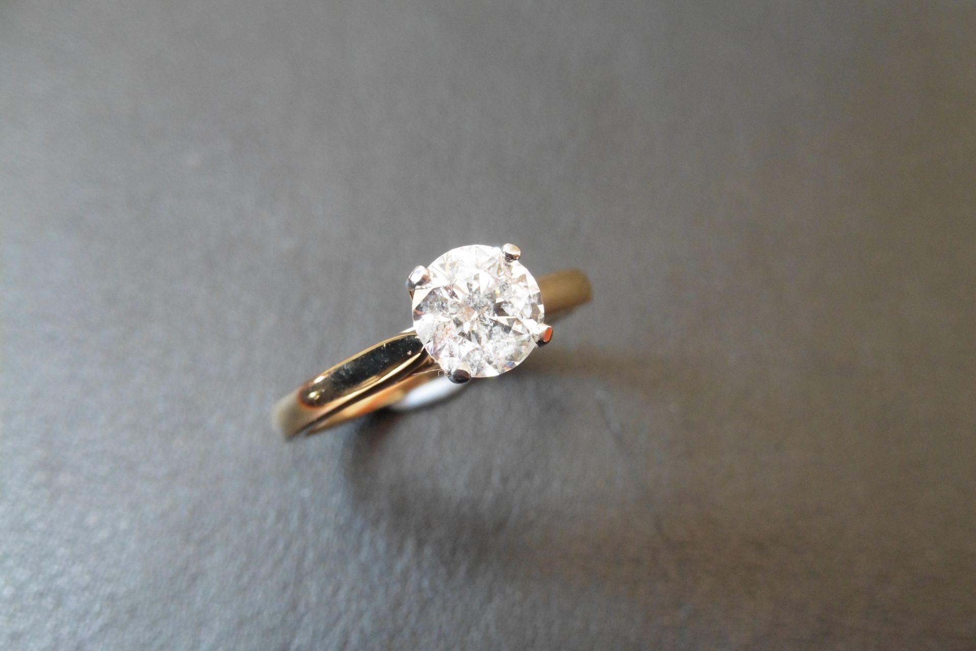 18ct gold diamond solitaire ring set with a 1.06ct brilliant cut diamond of G colour and Si3 clarity