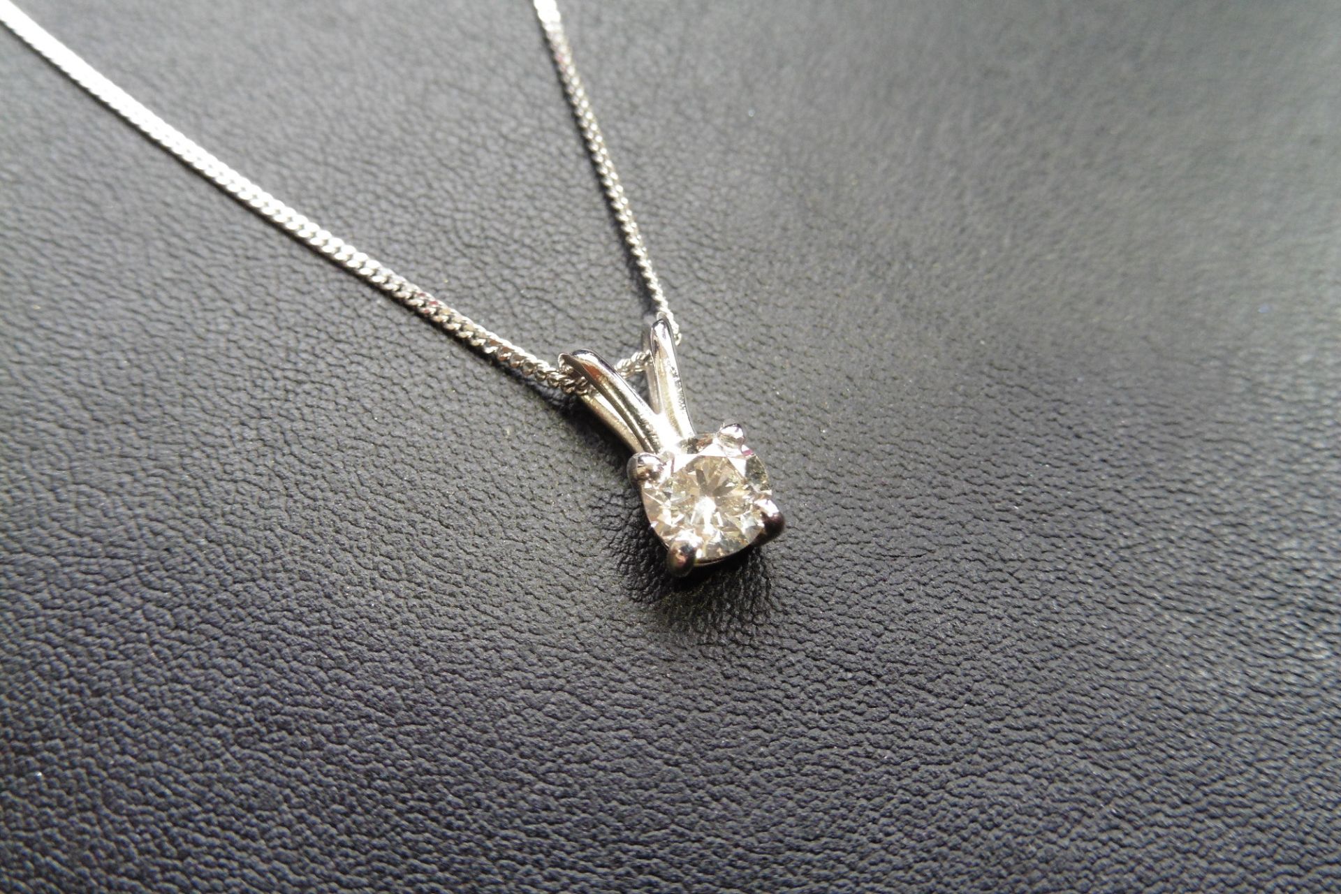 18ct white gold diamond solitaire style pendant set with a single brilliant cut diamond weighing 0.5