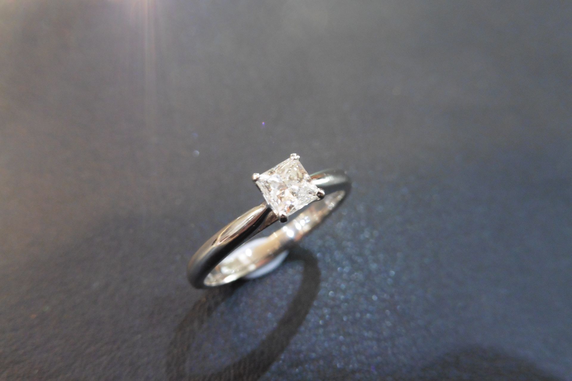 18ct white gold diamond solitaire ring set with a single princess cut diamond weighing 0.40ct, H col
