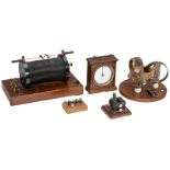 Group of Physical Instruments, c. 1920  1) Induction coil, width 8 ¾ in., with polarity charger. –