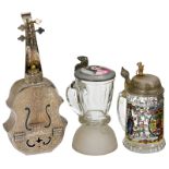 2 Musical Drinking Items, 20th Century
1) Fred Zimbalist-type engraved cello-form musical flask with