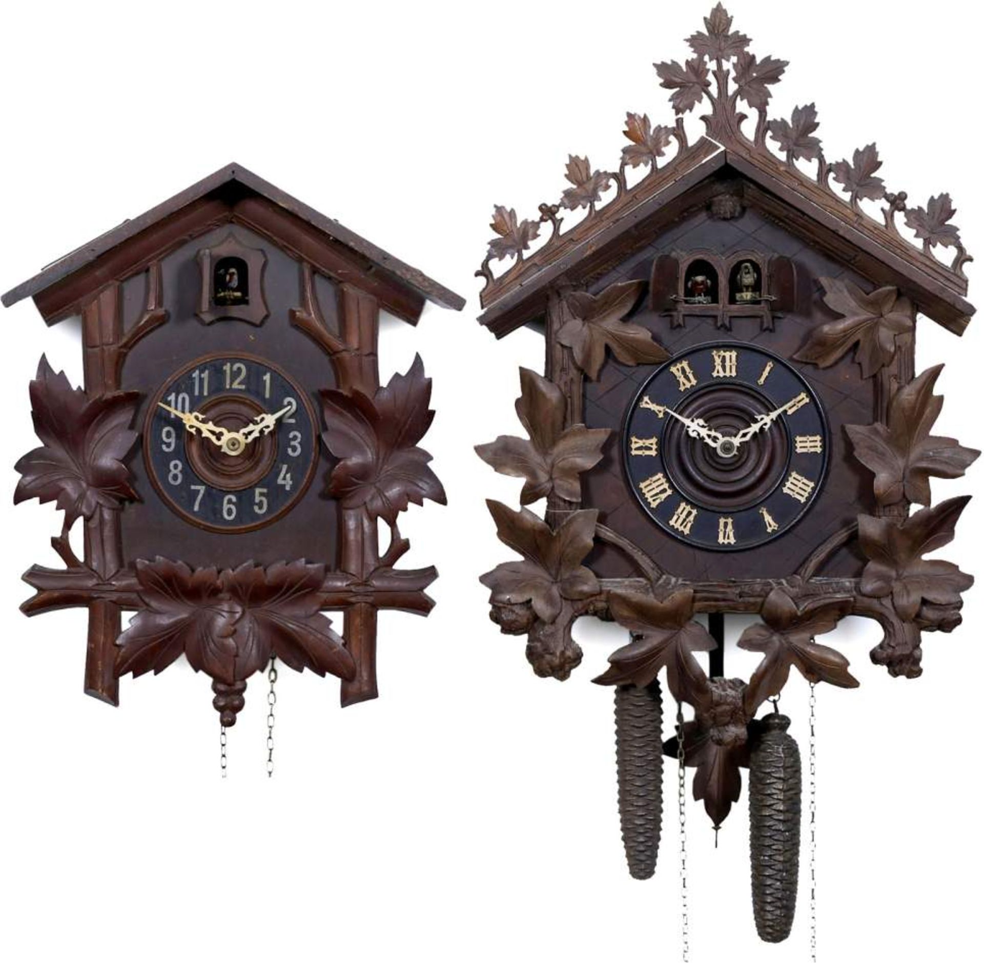 2 Black Forest Cuckoo Clocks, c. 1900
1) Large clock with cuckoo and quail, with 2 pipes each,