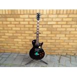 An Eros Les Paul Black Beauty style electric guitar with new pack of strings,