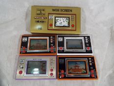 A collection of Nintendo game and watch consoles,