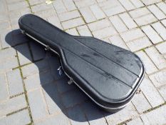A Hiscox hard shell acoustic guitar case