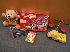 A mixed lot two include a Chad Valley twister chase car racing game, a Vtech talking Alfie bear,