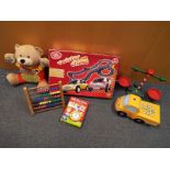 A mixed lot two include a Chad Valley twister chase car racing game, a Vtech talking Alfie bear,