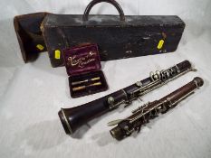 An early period clarinet in black leather case