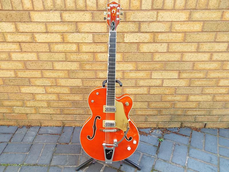 A Gretsch Brian Setzer semi-acoustic guitar, translucent amber finish, model G6120SSU, serial No.