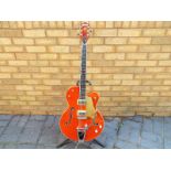 A Gretsch Brian Setzer semi-acoustic guitar, translucent amber finish, model G6120SSU, serial No.