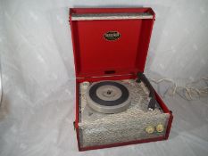 A Dansette Popular portable record player, red,