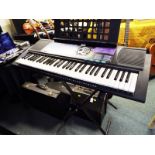 A Yamaha PSR-185 electronic keyboard with soft case, stand and power lead