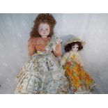 A dressed doll with hand painted features,