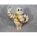 A cast iron figure depicting the Michelin man,
