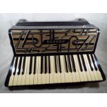 A Hohner Verdi IV piano accordian,